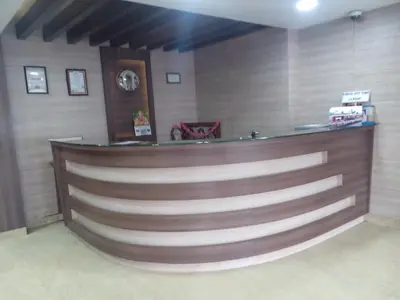 a barber shop with a wooden wall at Hotel Preethi Palace in Ooty