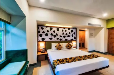 a bedroom with a bed with a leopard print headboard at Sterling Wayanad in Sultan Bathery