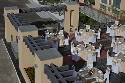 an overhead view of a restaurant with tables and chairs at Fairfield by Marriott Coimbatore in Coimbatore