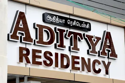 a sign on the side of a pharmacy headquarters at Aditya Residency in Pollāchi
