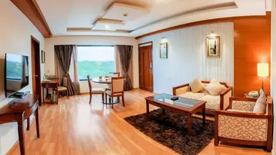 a living room with a couch and a table at Fortune JP Palace, Mysore - Member ITC Hotels' Group in Mysore