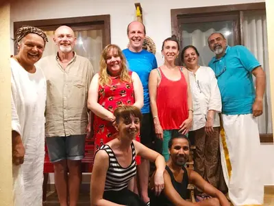 a group of people posing for a picture at Lakefront Beach Homes in Cherai Beach