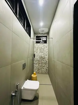 a small bathroom with a toilet in a room at Singaras Coffee Country in Masinagudi