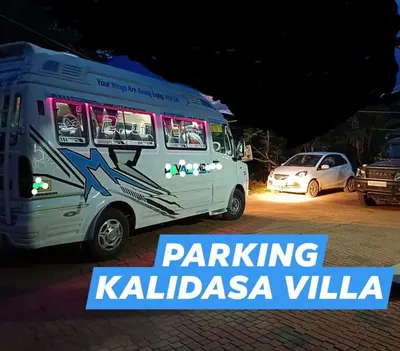 a white food truck parked in a parking lot at Kalidasa Tree House and Villa, Wayanad in Chekadi