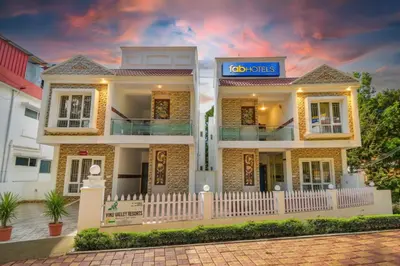 a house with a sign in front of it at FabHotel Vinu Valley Resorts - Nr Ketti Valley View Point in Ooty