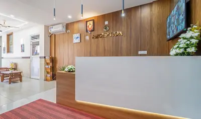 a lobby of a hospital with a white counter at Treebo Thoduvas Star Plaza Cochin Airport in Nedumbassery