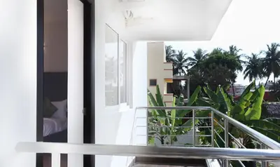a balcony with a view of a building at Treebo Hi Line Apartments Kalapatti in Coimbatore