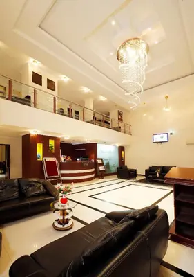 a large living room with a ping pong table at Rose International Hotel in Nilambūr