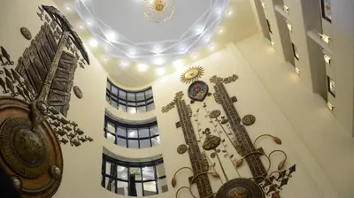 a building with clocks on the walls and a ceiling at Sandesh The Prince in Mysore
