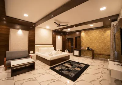 a living room with a bed and a couch at SR Jungle Resort in Coimbatore