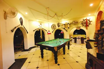 a large room with a pool table in it at Emarald Resort in Pulamanthole