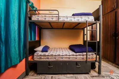 a bunk bed room with two bunk beds at Zostel Mysore in Mysore
