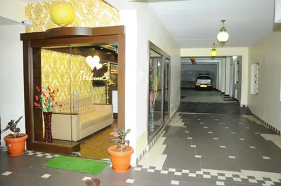 a hallway of a building with a store at Hotel Lovely Nest in Coimbatore