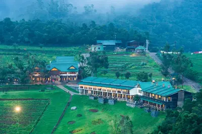 an aerial view of a resort in a field at Destiny - The Farm Resort in Ooty