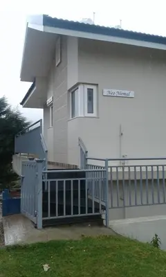a house with a gate in front of it at Neo Nirmal Residency in Ooty