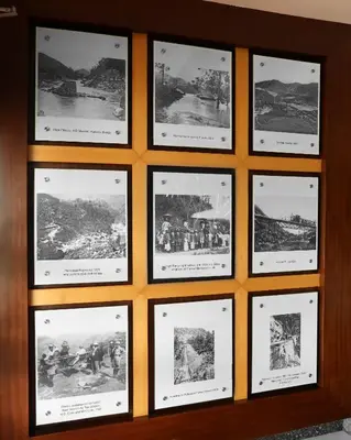 a group of pictures hanging on a wall at Elysium Garden in Munnar