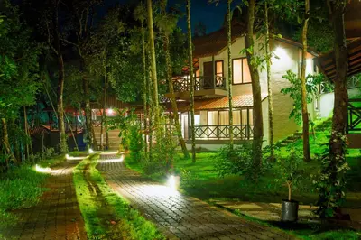a house at night with a walkway in front at The Serenity Resort in Tariyod