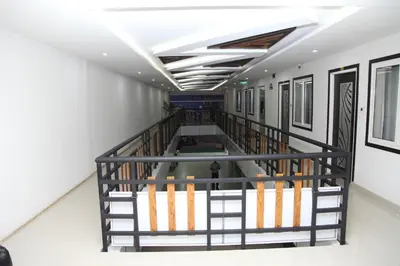 an empty hallway in a building with a ceiling at ALSHIFA TBG RESIDENCY in Perintalmanna