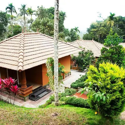an image of a house with a garden at Indeevara Luxury Resort and Spa, Wayanad in Vythiri