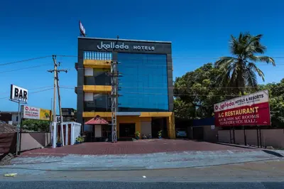 a building with a sign that reads kolkata motel at Kallada Hotels and Resorts in Trichūr