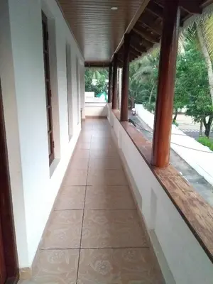 a hallway of a house with a tile floor at Swasthigriha's Beach Homestay, Cherai in Cherai Beach