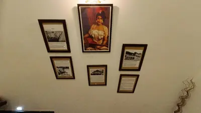 a wall with a bunch of pictures on it at Swasthigriha's Beach Homestay, Cherai in Cherai Beach