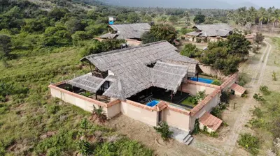 an overhead view of a house with solar panels on its roof at SpiceTree Chinnar in Dhali
