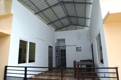 a view of the lobby of a building with a ceiling at Back Packers Cochin Villa in Cochin