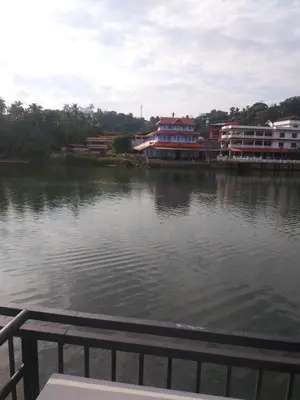 a view of a body of water with buildings at 7TH HEAVEN Kannur in Chakkarakkal