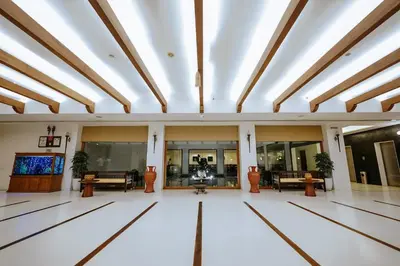 a large room with a ceiling with skylights at Hotel Devaragam by K P Namboodiri's in Guruvāyūr