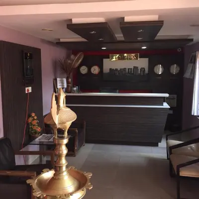 a room with a bar with a piano in it at French Avenue in Kallāyi