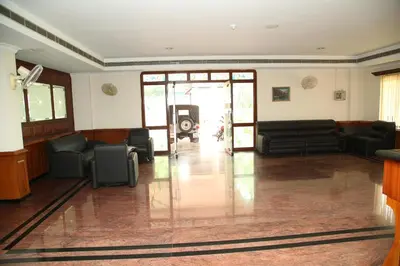 a living room with couches and chairs in a building at Kallada Residency in Kodungallūr