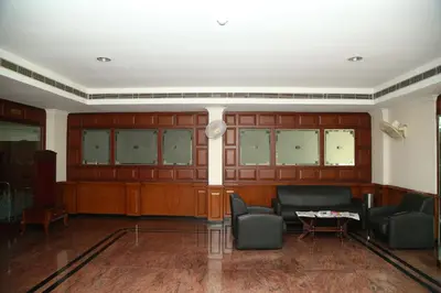 a living room with a couch and chairs and a table at Kallada Residency in Kodungallūr