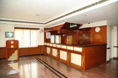 a large room with wood paneling and a counter at Kallada Residency in Kodungallūr