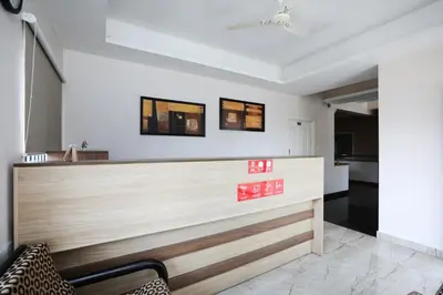 a bar in a room with a counter at Super Hotel O Indra Comforts in Belagula