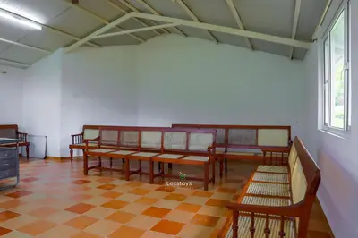 a room with wooden benches and a checkered floor at Yellow Tulip Hill Side Luxury Villa by LexStays in Coonoor