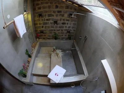 an overhead view of a bathroom with a bath tub at Estate Stay - Riverside Coffee in Siddapur