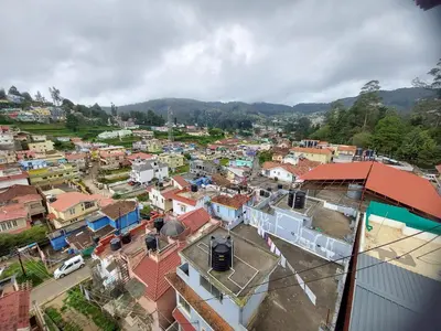 an aerial view of a town with buildings at Astoria Residency in Ooty