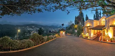 a cobblestone street in a mansion at night at Club Mahindra Danish Villa, Ooty in Ooty