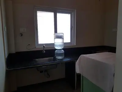 a bathroom with a sink and a window at Comfort`s Pearl in Coimbatore