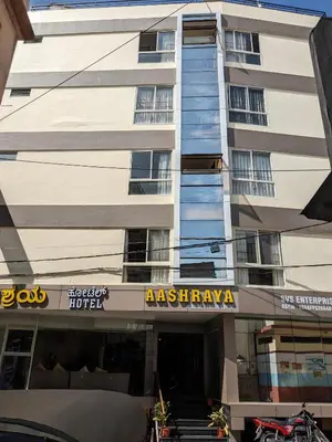 a building with an asianuayka hotel at Aashraya in Mysore