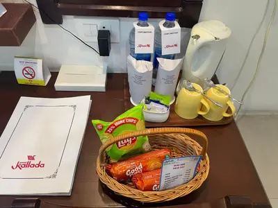 a basket of food and drinks on a table at Kallada Sangeetha Hotels in Trichūr