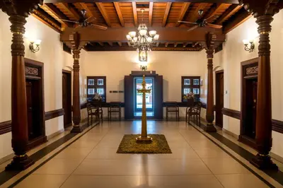 a hallway with a cross in the middle of a building at Villa De 1945 in Mahe
