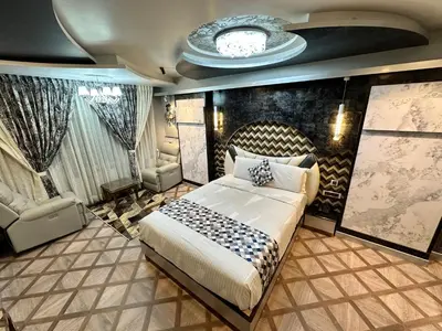 a bedroom with a large bed in a room at Beverly villa in Ooty