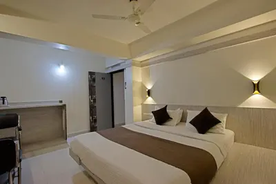 a bedroom with a large bed in a room at Mannars Residency in Mysore
