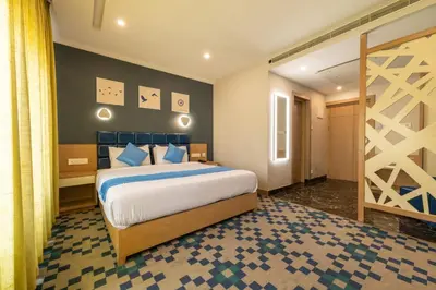 a bedroom with a large bed in a room at Mintotel Wayanad in Sultan Bathery