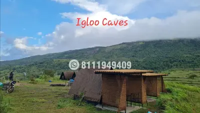a sign that says igloo caves on a hill at Shining Caves Resort in Varagampadi