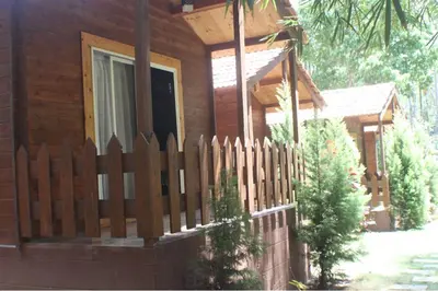 a wooden fence in front of a house at Coorg amodhini in Madikeri