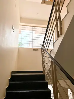 a staircase in a house with a window at The INN in Mysore
