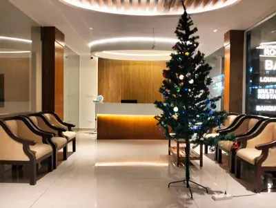 a christmas tree in the middle of a lobby at GAYATHRI HOTELS in Badagara